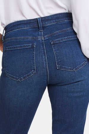 Click here to shop women's dark wash jeans