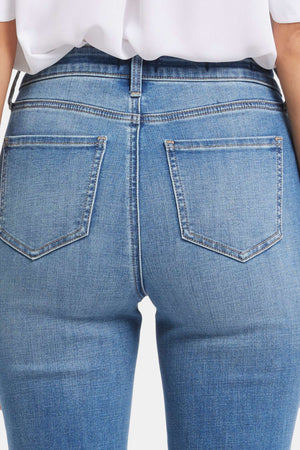 Click here to shop women's medium wash jeans